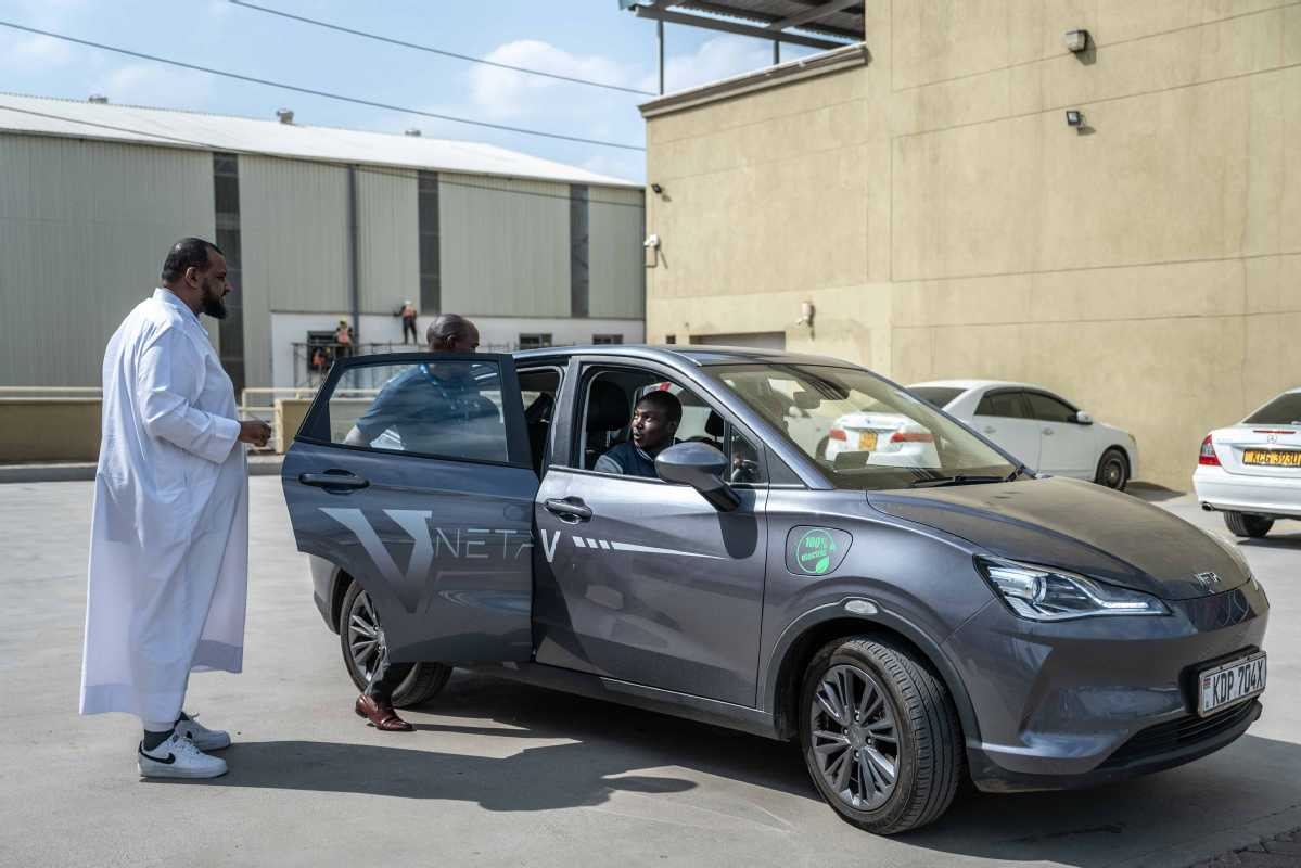 Kenyans test drive the Neta V electric crossover.